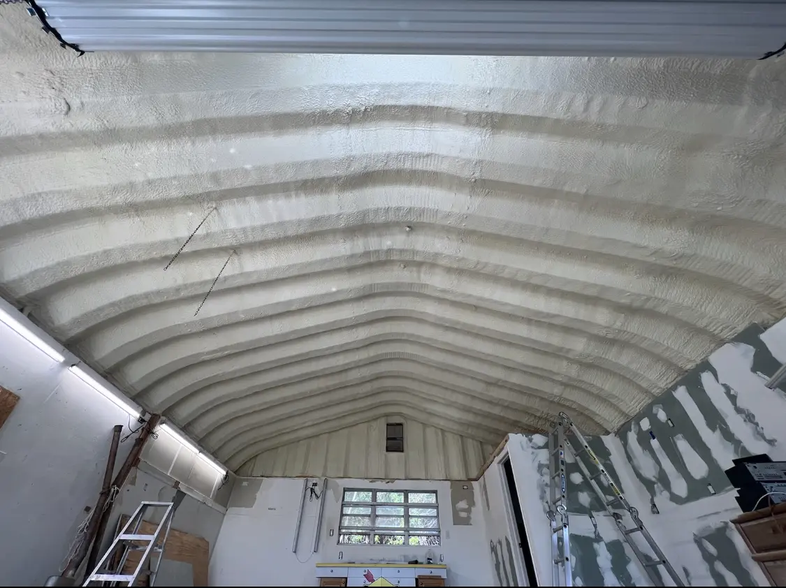 Spray polyurethane foam applied to the underside of a metal roof deck in Harwich